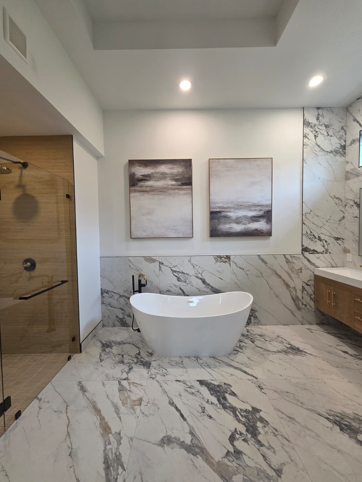 Delray Beach bathroom with a freestanding bathtub and glass shower