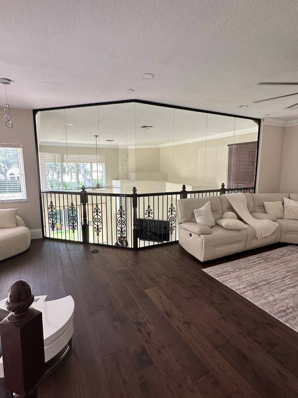 Glass enclosure around an upper-level living area
