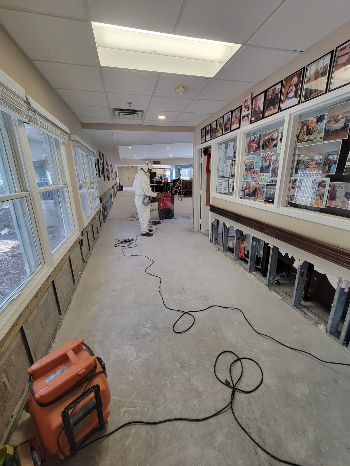 VMA remediation work in progress with exposed lower wall framing and drying equipment